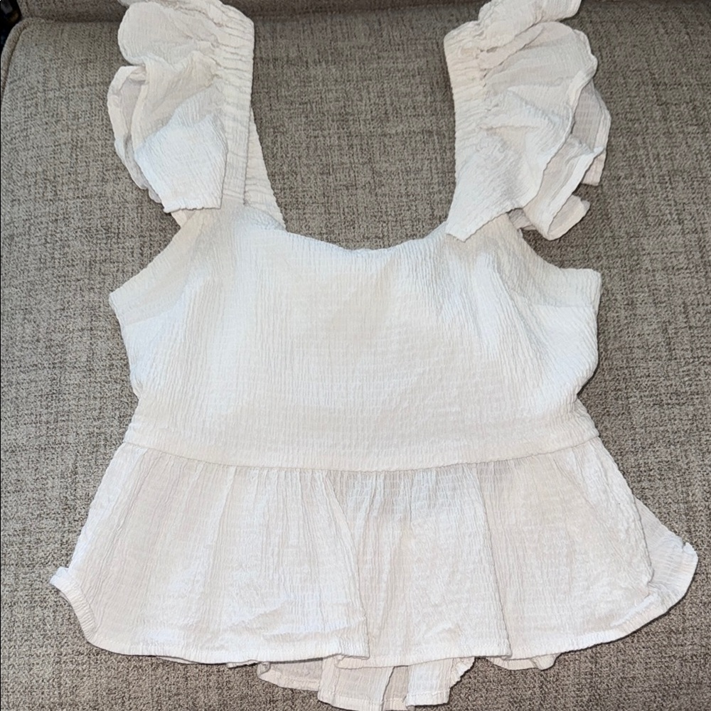 White Ruffled Peplum Blouse Sleeveless